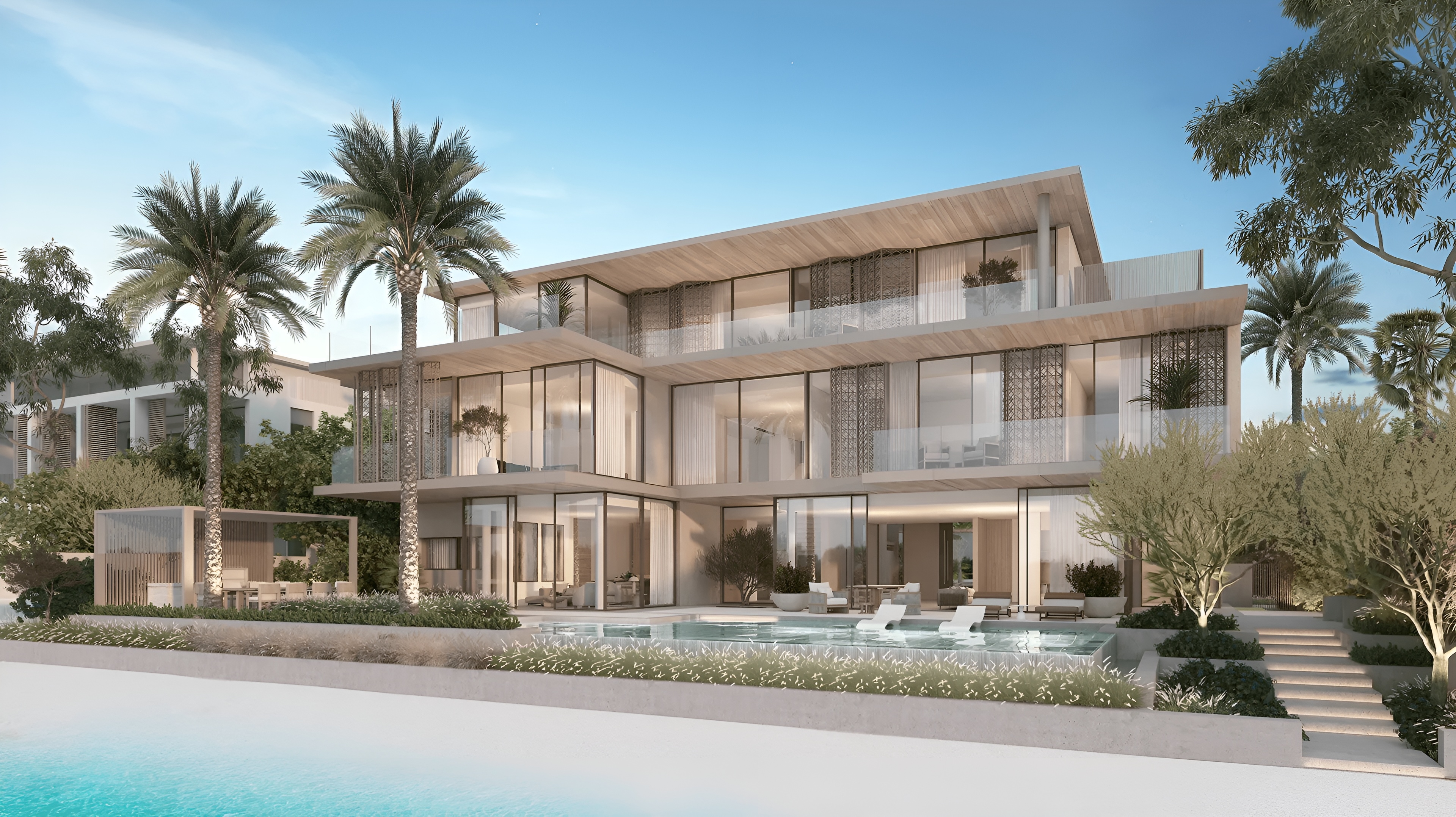 The Beach Collection consists of luxurious villas developed by Nakheel Properties on Palm Jebel Ali, known for creating Palm Jumeirah. It is nestled within The Palm Jebel Ali where Dubai's longest shoreline seamlessly meets the city's skyline. This luxurious living masterpiece is perfectly located between Port Jebel Ali and the Jebel Ali Marine Sanctuary, with excellent connectivity to other parts of Dubai via the Sheikh Zayed Road. The villas are three stories tall, offering 5-6 bedrooms and starting at 7,000 sqft. There are eight different villa types, including Tropical Mist, Sapphire, Provence, Mediterranean, Indigo Ocean, Blue Horizon, Azure Blue and Aquamarine. They are thoughtfully designed to complement the beautiful waterfront setting, providing a peaceful and exclusive living environment. Nakheel Properties, known for Palm Jumeirah, is the developer behind this project, set to be completed in 2027. Prices for these coastal homes start at AED 18 million, with the convenience of an 80/20 payment plan.