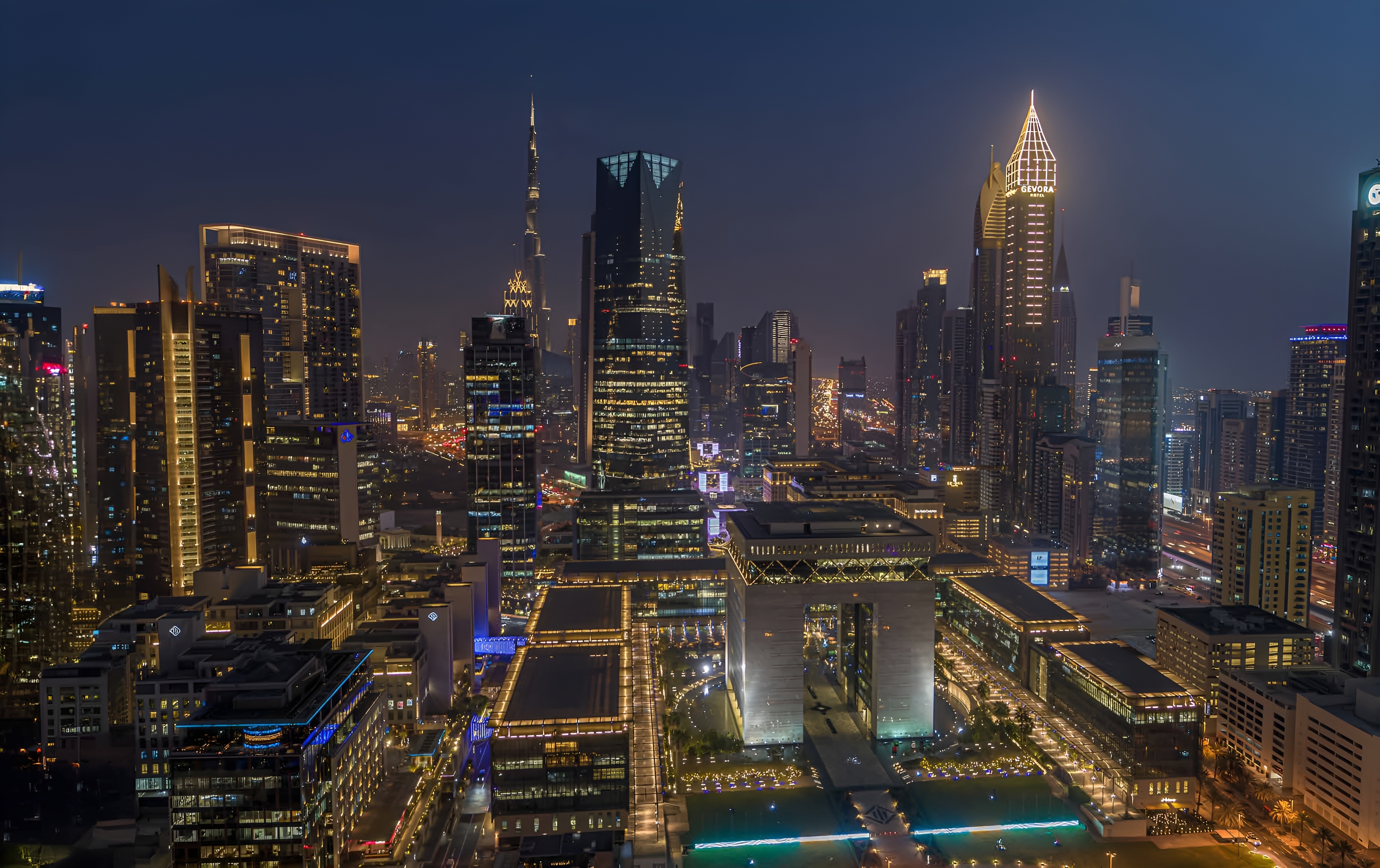 In the heart of Dubai International Financial Centre, DIFC Living ushers in a new era of city living. The residences at DIFC Living embody elegance and style, reflecting a forward-looking vision of modern living. These living spaces are generously sized and well-proportioned. Its architectural design is remarkable, featuring interconnected geometric forms with a distinctive twisted cube atop the tower. With its unique design inspired by nature, the building incorporates natural light, open terraces, green spaces, and a healthy living environment, establishing itself as a dynamic lifestyle hub. DIFC Living offers world-class amenities, including concierge services, private meeting spaces, lounges, a temperature-controlled infinity pool, a gym, a private cinema hall, a children's play area, and more. DIFC Living presents a variety of 1 to 3-bedroom apartments. Anticipated completion is set for Q3 2026 with prices starting at AED 1.5 million and a convenient 70/30 payment plan.