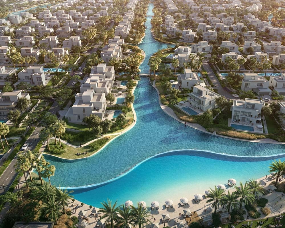 Imagine stepping out your door to a symphony of water. Gentle streams weave through Palmiera at The Oasis, a residential enclave by Emaar, creating a calming embrace. This tapestry of waterways fosters a serene ambiance, inviting you to unwind amidst nature's embrace. Palmiera at The Oasis seamlessly blends tranquility with excellent connectivity. Nestled within The Oasis, it offers easy access to Dubai's vibrant pulse via major transportation routes. Find serenity moments away from the city's energy, yet remain close to its bustling attractions. The development itself is a masterpiece. Spacious plots graced by sprawling 4 and 5-bedroom villas offer a sense of grandeur. Panoramic vistas showcase shimmering lakes, tranquil canals and verdant parks, creating a picture of perfect harmony.   Every detail, from the facades to the interiors, whispers of luxury. Designed by renowned architects, the villas prioritize comfort and a connection to the surrounding beauty. Natural light spills into the homes, fostering a seamless integration with the outdoors. Palmiera at The Oasis extends beyond just residences. The Oasis boasts world-class amenities, creating a holistic lifestyle experience. Residents enjoy unparalleled comfort and convenience, with everything from state-of-the-art fitness centers to serene spa facilities at their fingertips. Starting at AED 8.5 million, Palmiera at The Oasis by Emaar offers 4 and 5-bedroom villas. The handover is expected in Q4 2027 with an 85/15 payment plan.